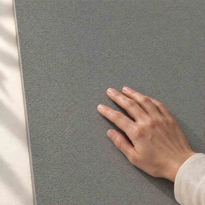 Archicross Base Grey Structure A (R11) 60x30cm – hand touching finely textured Structure A surface – product render