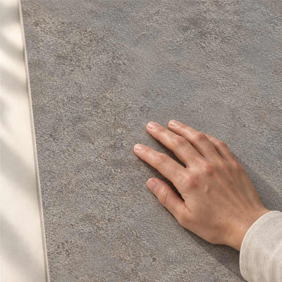 Archicross Concept Grey Structure A (R11) 60x30cm – hand touching finely textured Structure A surface – product render