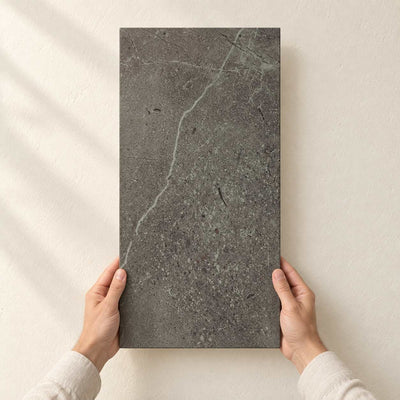 Archicross Concrete Black Matt (R10) 60x30cm – full tile held in hands – product render