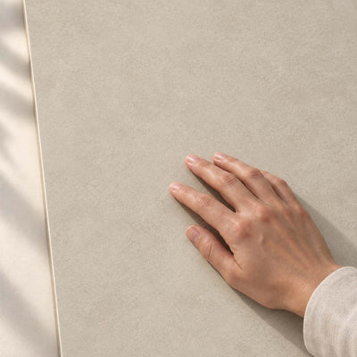 Architeq Beige Matt 120x60cm porcelain tile – hand touching the matt surface – product render