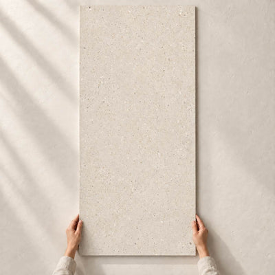 Architeq Grain Crema Matt 120x60cm porcelain tile – full tile held in hands – product render