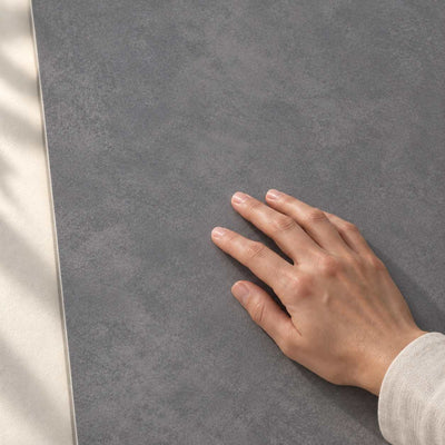 Architeq Graphite Matt 120x60cm – hand touching tile surface – product render