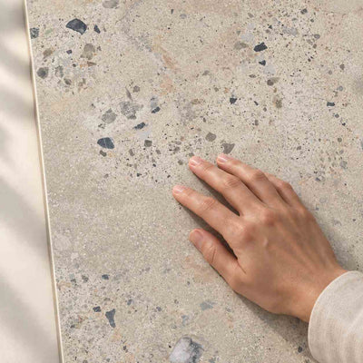 Architeq Rock Beige Matt 120x60cm porcelain tile – hand touching the matt surface – product render