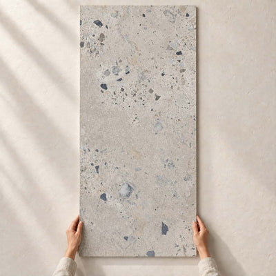 Architeq Rock Light Grey Matt 120x60cm – full tile held in hands – product render
