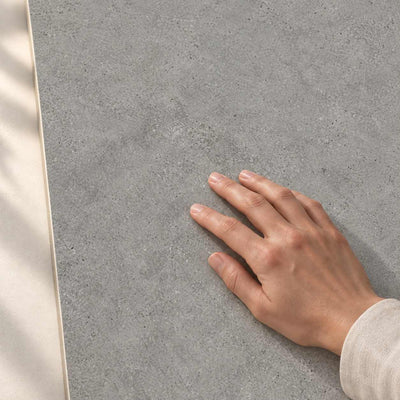 Authority Grey - Matt  Porcelain Tile 120x60cm – hand touching tile surface – product render