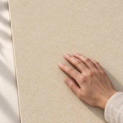 Convero Beige Matt 120x60cm porcelain tile render - hand touching the matt tile surface