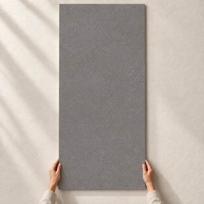 Convero Graphite Matt 120x60cm porcelain tile render - full tile held upright by hands