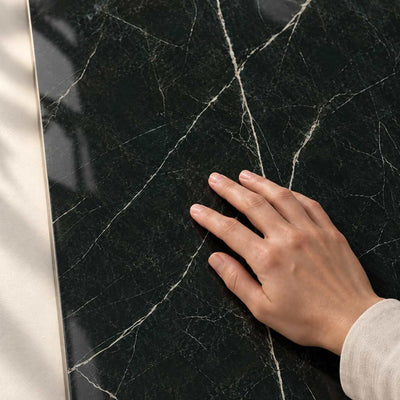 Desire - Black Gloss Polished 120x60 Glazed Porcelain Tile 120x60cm – surface detail with hand – product render