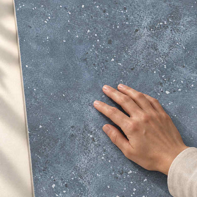 Smooth Freedom Blue Ceramic Wall Tiles – 25x75cm (Rectified) 25x75cm – surface detail with hand – product render