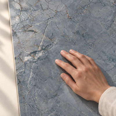 Monet Blue - Polished Glazed Porcelain Tile 120x60cm – surface detail with hand – product render