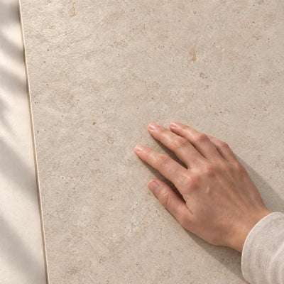 Relis Beige Structure Matt 120x60cm porcelain tile render - hand touching the matt tile surface