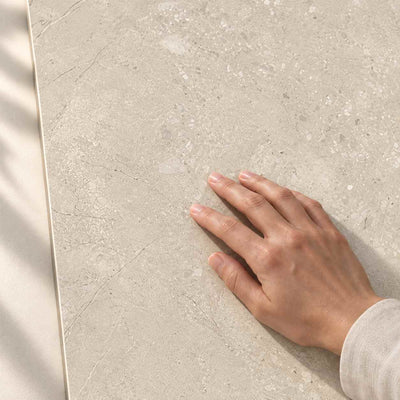 Sedina Light Beige Matt 120x60cm – hand touching tile surface – product render