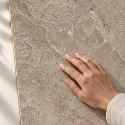 Storm Slate Taupe Matt 120x60cm – hand touching tile surface – product render