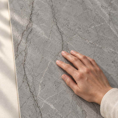 Visioner Grey - Polished 120x60cm – surface detail with hand – product render