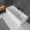 white cubic bath in grey bathroom with black tap