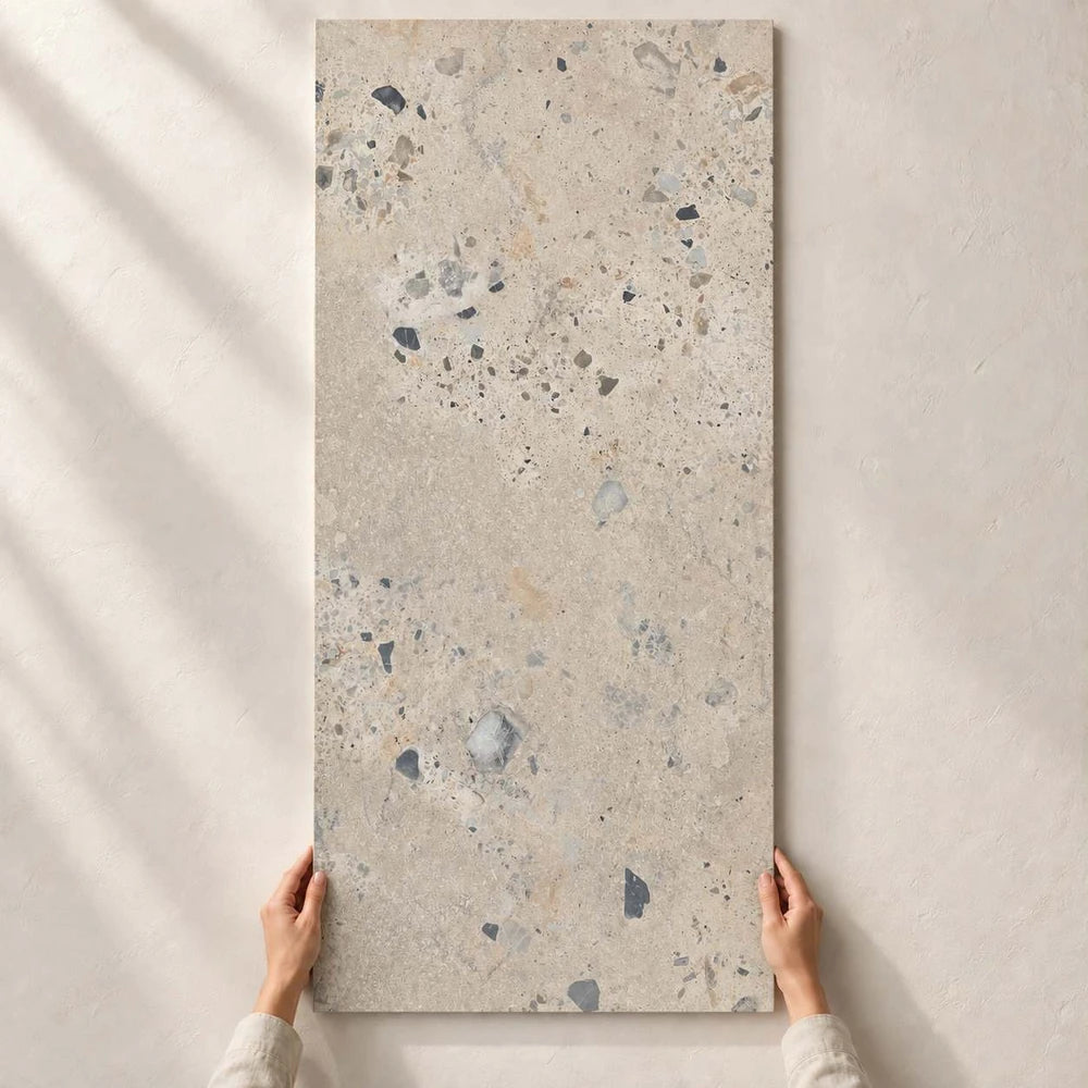 Architeq Rock Beige Matt tile held by hand
